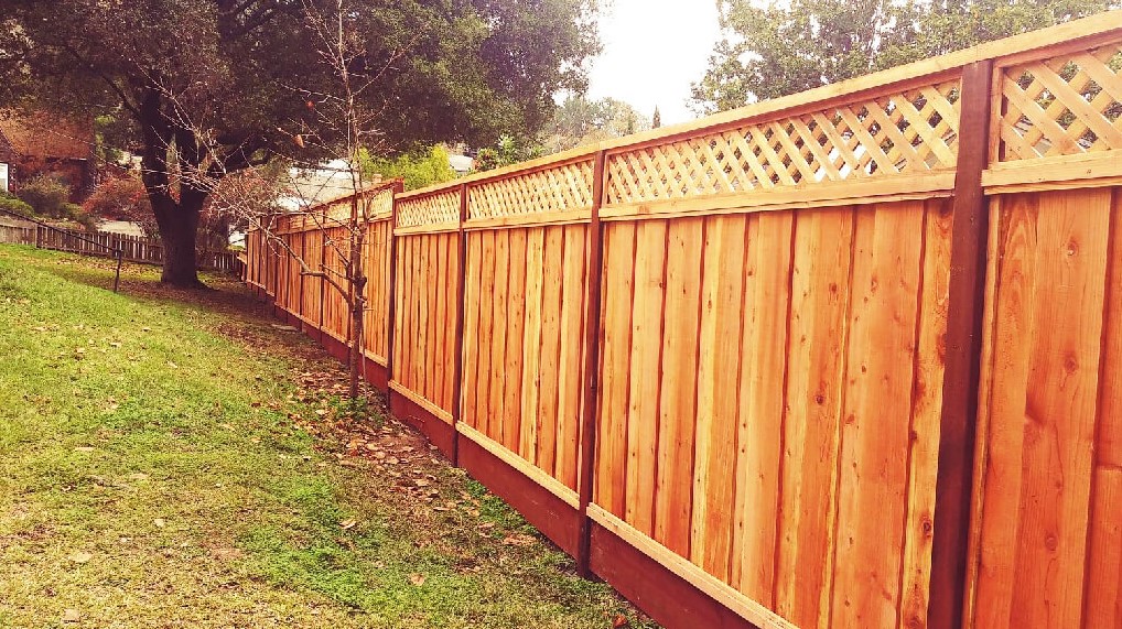 neighbor’s fence on my property in Huntsville AL